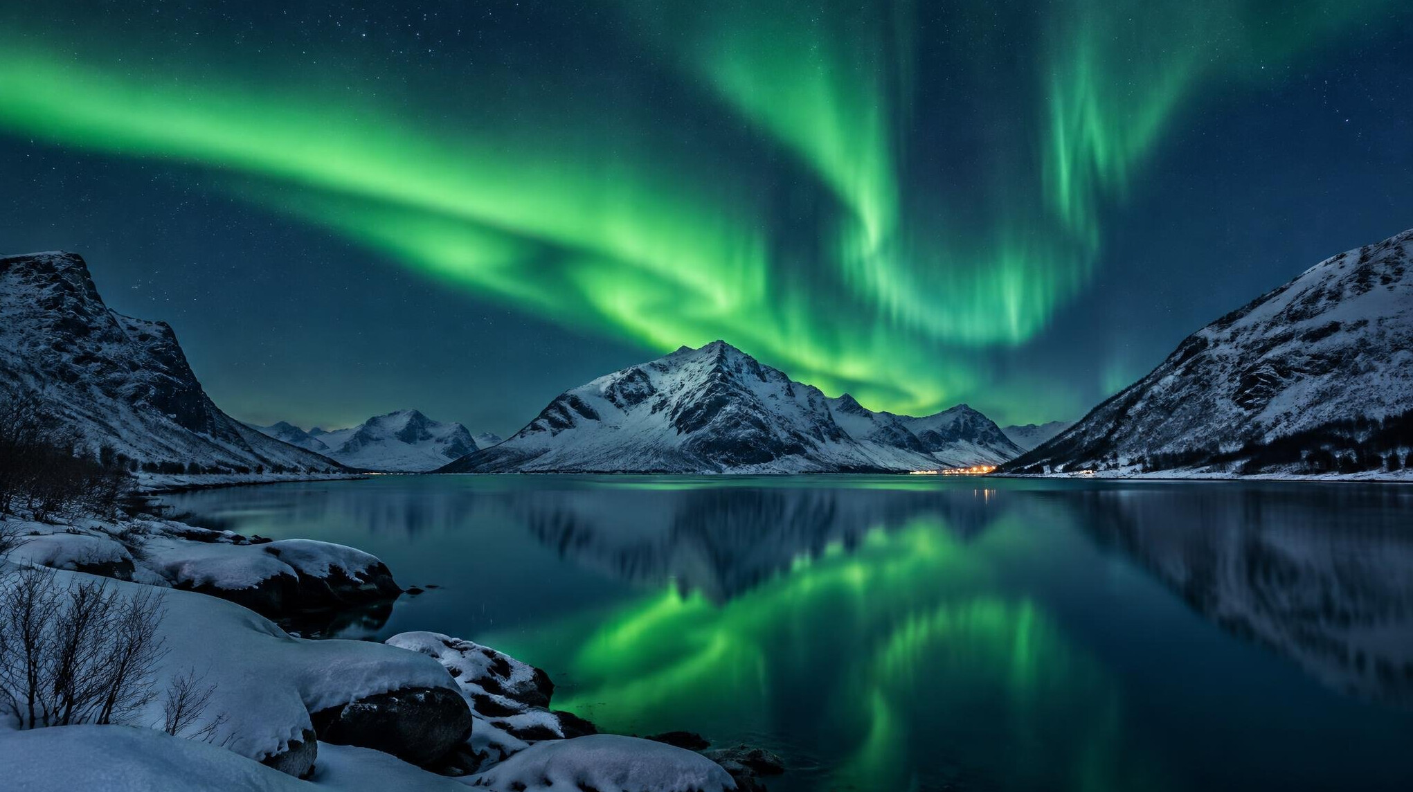 Northern lights over a snowy northern landscape