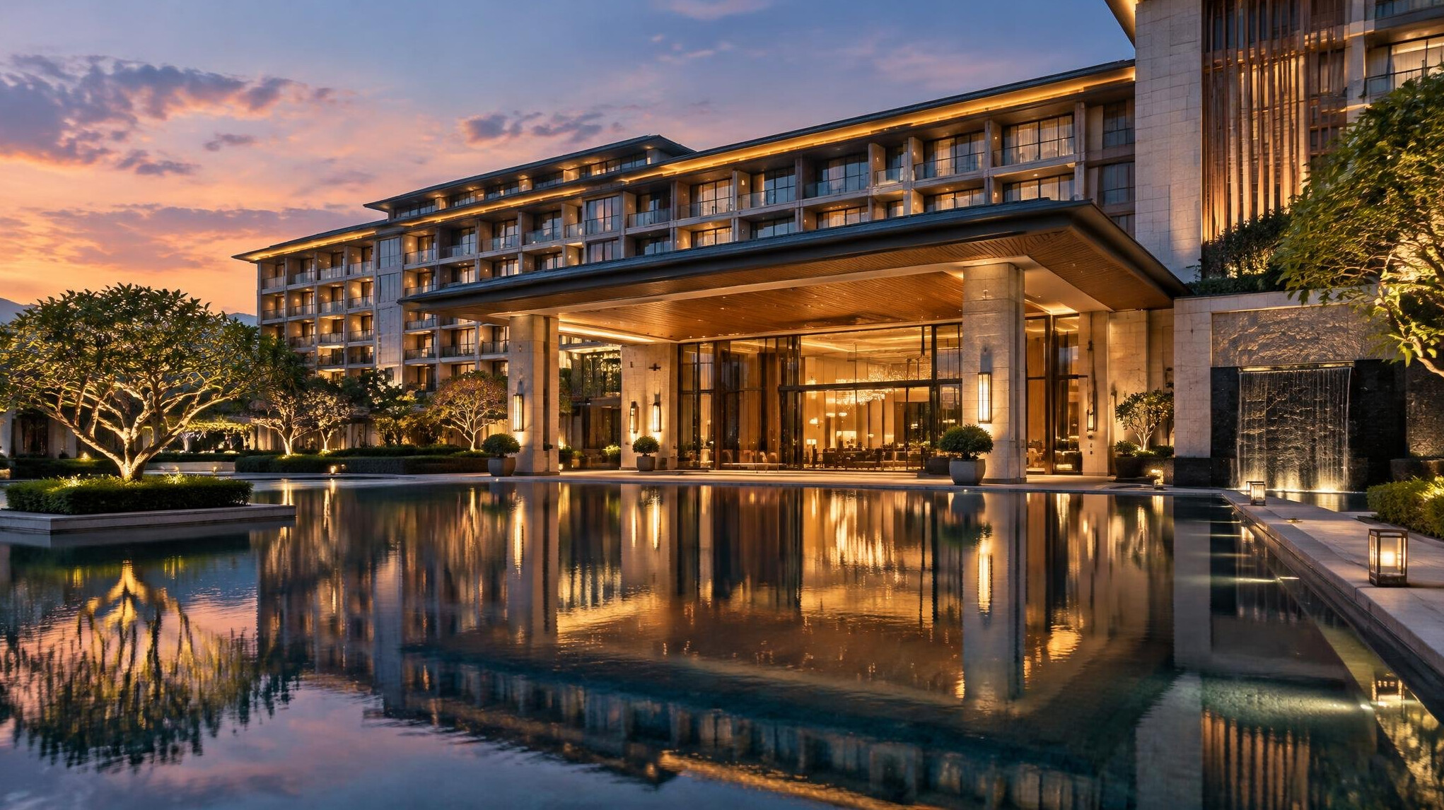 Exterior of a modern luxury hotel at dusk